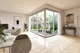 Rendering dell'interno appartamento che guarda verso il patio